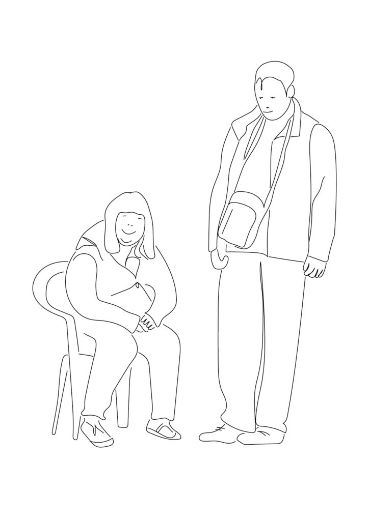 Sitzende junge Frau mit stehendem jungem Mann